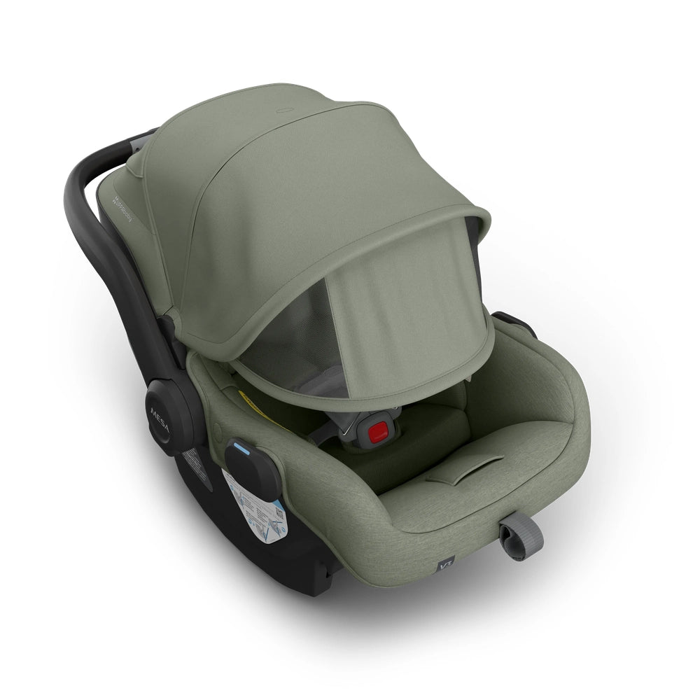 UPPABABY Mesa V3 Infant Car Seat in olive green with canopy extended, showing the integrated handle and cushioned interior.