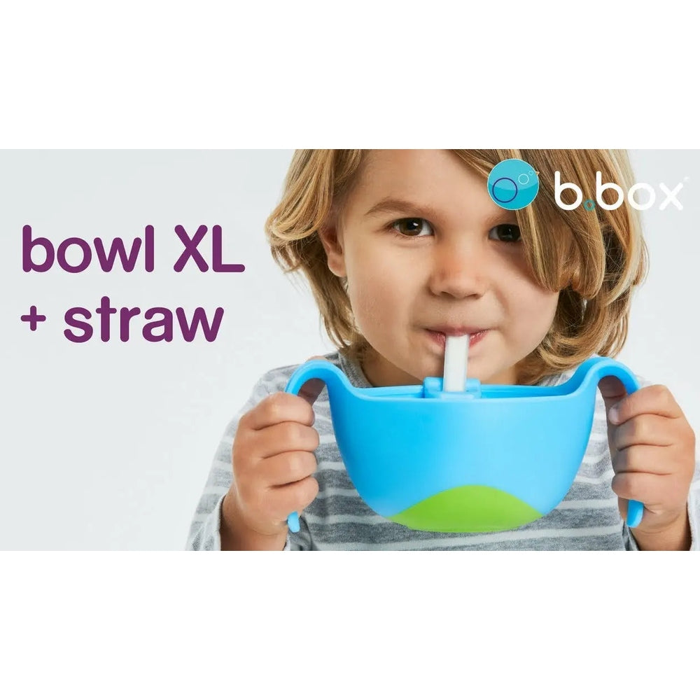 b.box Bowl XL + straw, blue with green accent, toddler enjoying a sip during mealtime.