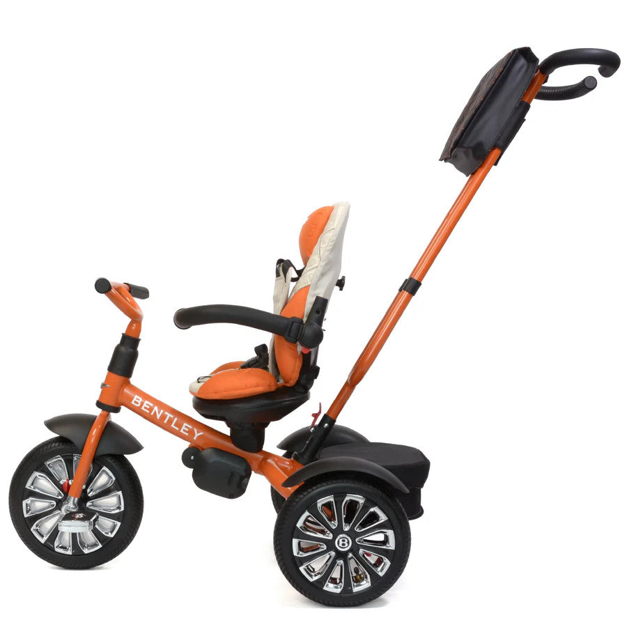 Bentley Trike 6-in-1 V2 Mulliner Mandarin toddler tricycle with orange frame and long push handle