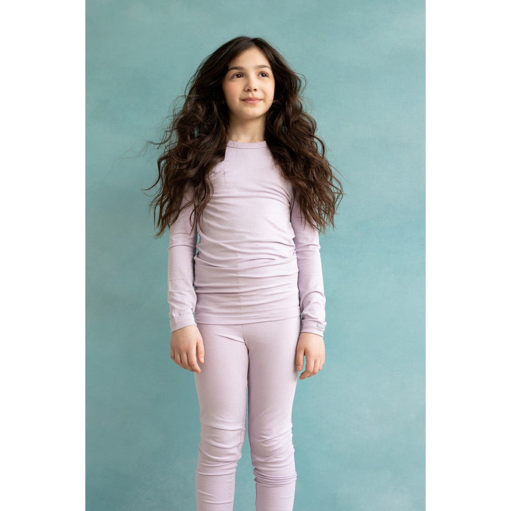 Coccoli Kid Long Sleeve Cotton TENCEL™ Modal Pyjamas Lavender Fog Jersey worn by a girl in lavender pajamas, showcasing cozy soft knit.