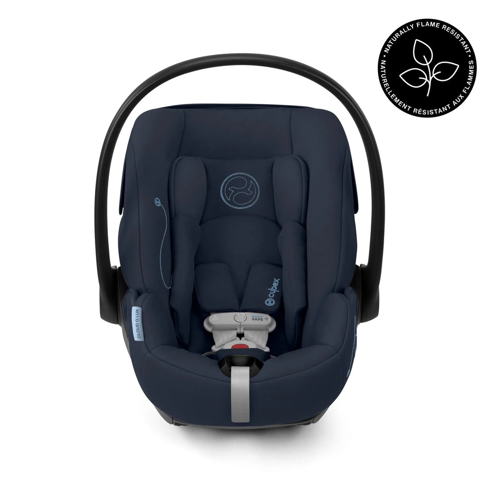 Cybex Cloud G Lux reclining infant car seat in navy fabric, curved carry handle shown for easy transport.