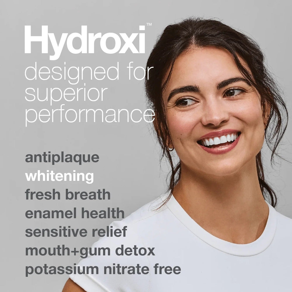 Davids Toothpaste Sensitive & Whitening Fluoride Free Peppermint; smiling woman shows bright teeth, hinting whitening and enamel health.