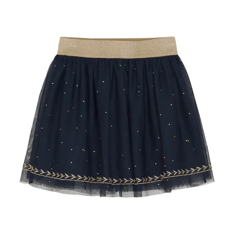 En Fant tulle skirt in Parisian Night navy with gold waistband, specks, and laurel-embroidery hem.