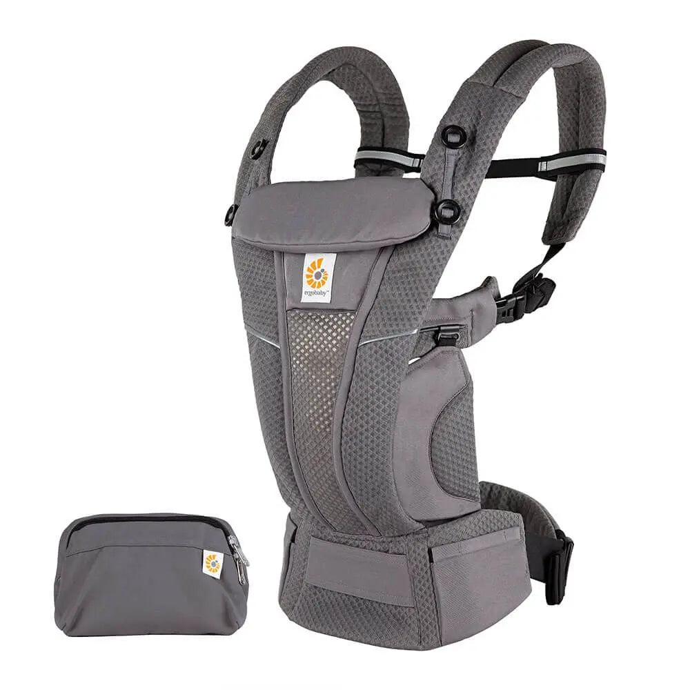 Ergobaby Omni Breeze gray baby carrier with padded straps and waist belt, plus accessory pouch.