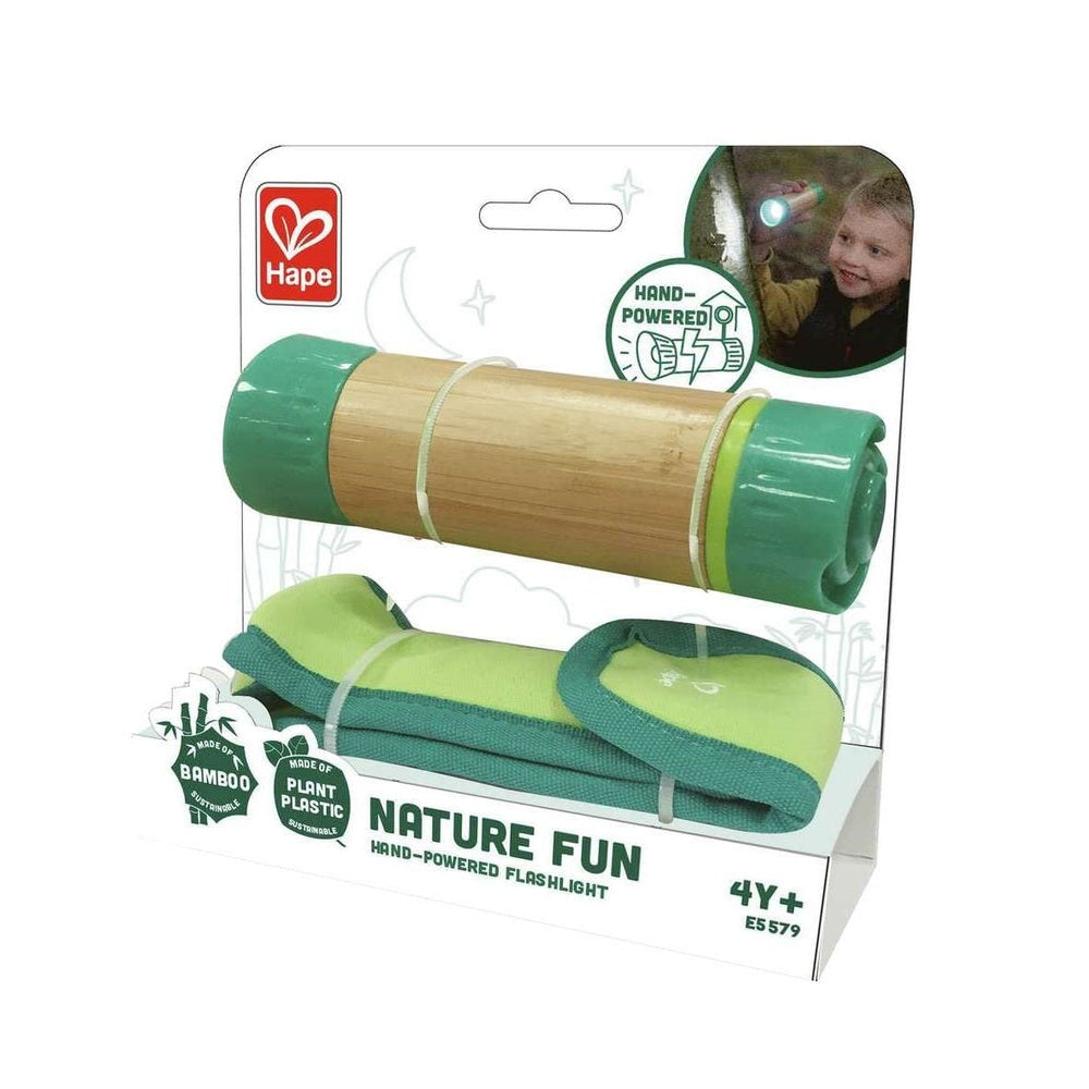 Hape hand-powered flashlight toy with bamboo barrel and green ends; includes green carrying case
