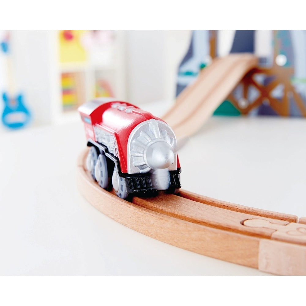 Hape Propeller Engine toy train on curved wooden track; red body, silver propeller spins.