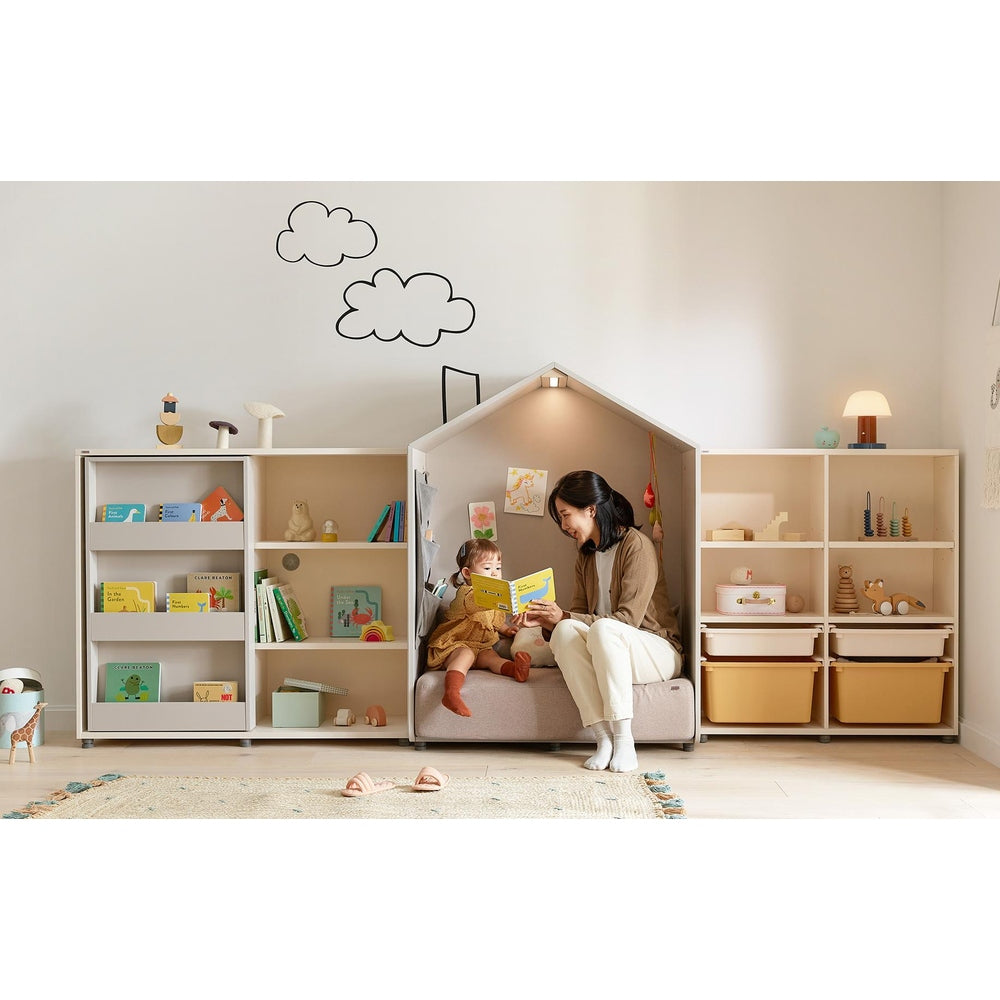 ILOOM Eddi Kids Reading House sofa with light wood shelves and cozy toy-filled reading nook