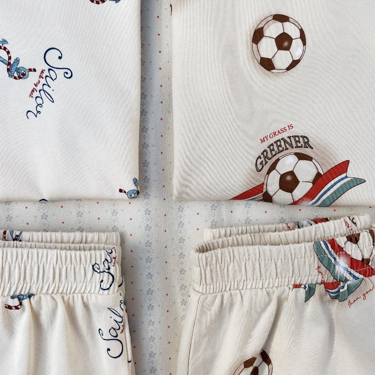 Konges Slojd basic two-piece set, white cotton with soccer ball print and elastic waist shorts