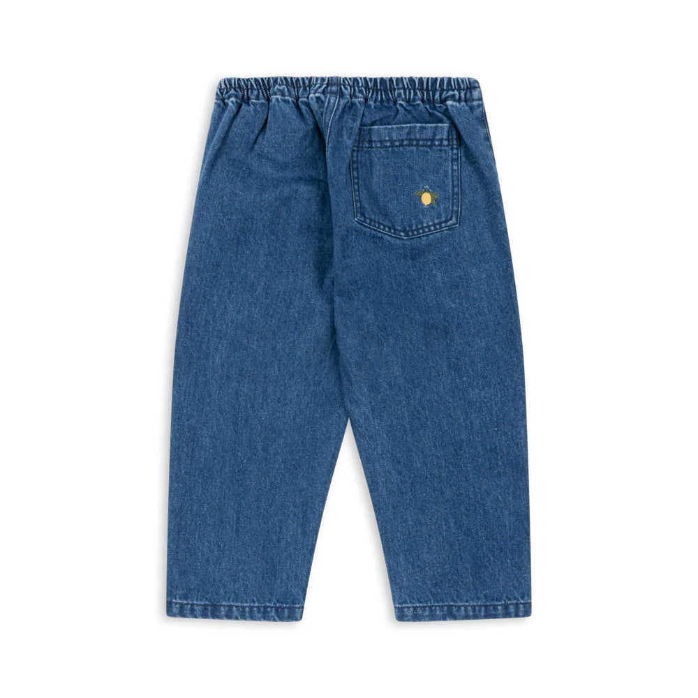 Konges Slojd Denim Pants Gots Denim Blue, elastic waistband visible with back pocket showing yellow logo.