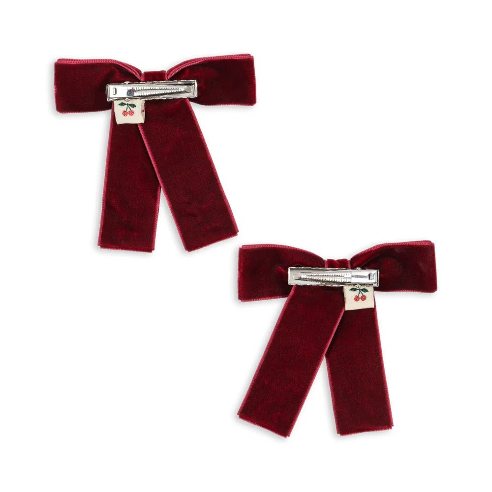 Konges Slojd Juliette Bow Hair Clip 2 Pack Rio Red; velvet red bows being secured with silver clasps.