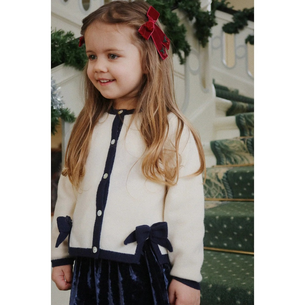 Konges Slojd Juliette Bow Hair Clip 2 Pack Rio Red: girl wears two red velvet bows in her hair.