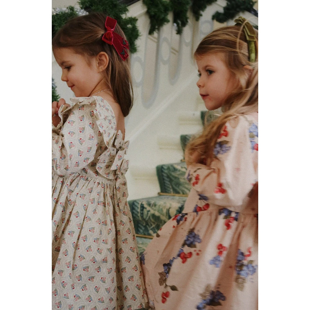 Konges Slojd Juliette Bow Hair Clip 2 Pack Rio Red worn by a girl with a red bow in her hair.