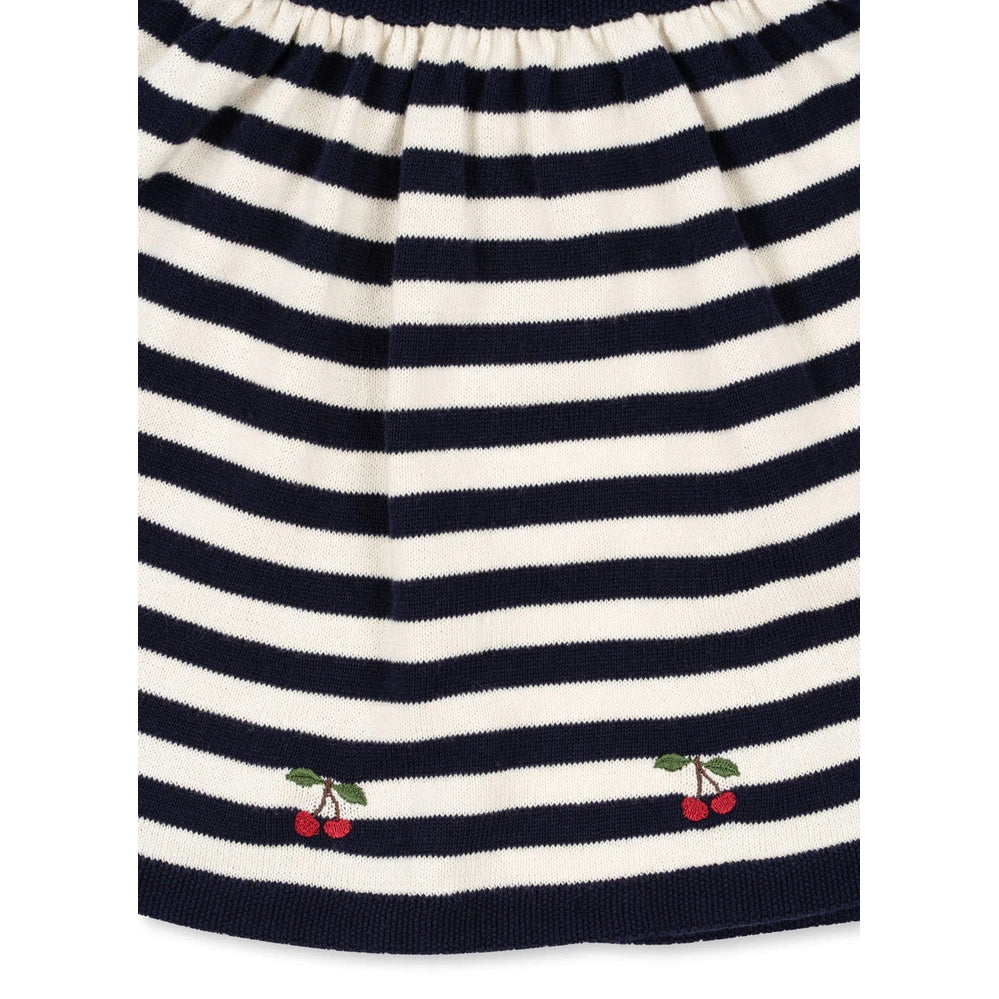 Konges Slojd Venton cotton knit skirt in navy stripe, laid flat showing small cherry embroidery at the hem.