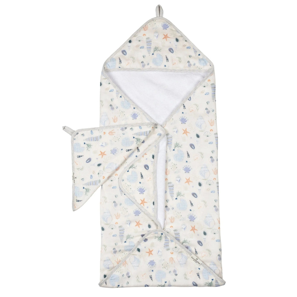 Loulou Lollipop Hooded Towel Set for babies; cream seashell print shown with hooded towel and accompanying washcloth.