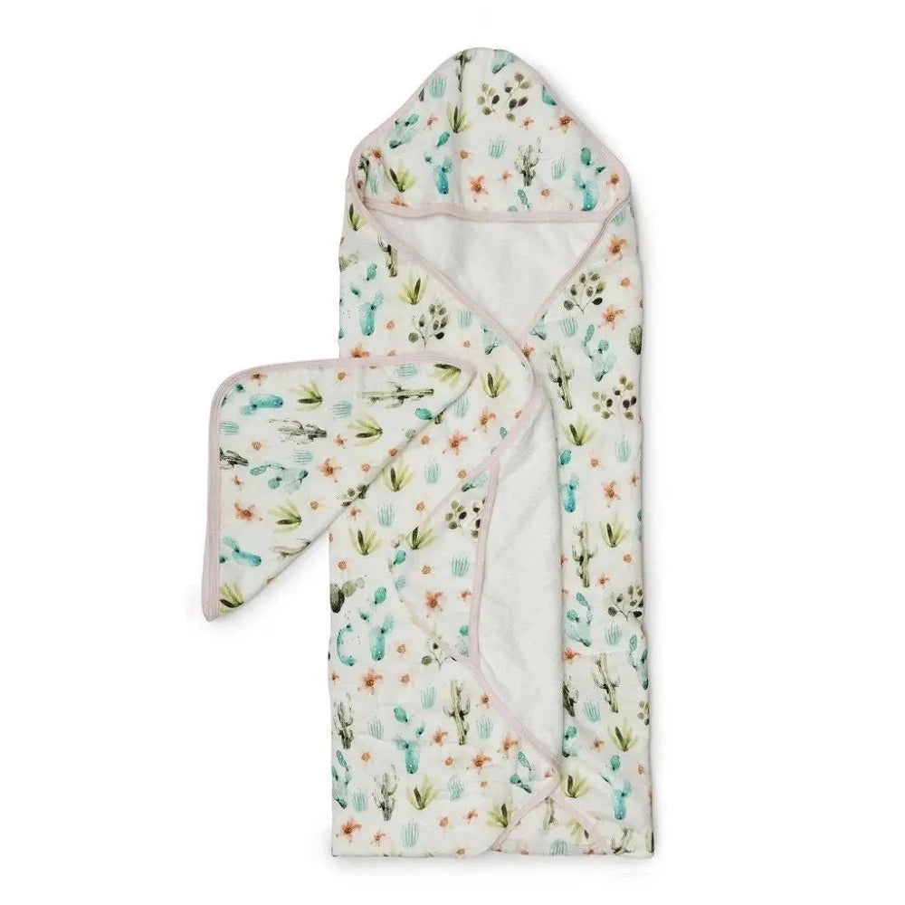 Loulou Lollipop Hooded Towel Set in cactus print with pink trim; hooded towel plus matching wash mitt laid out.