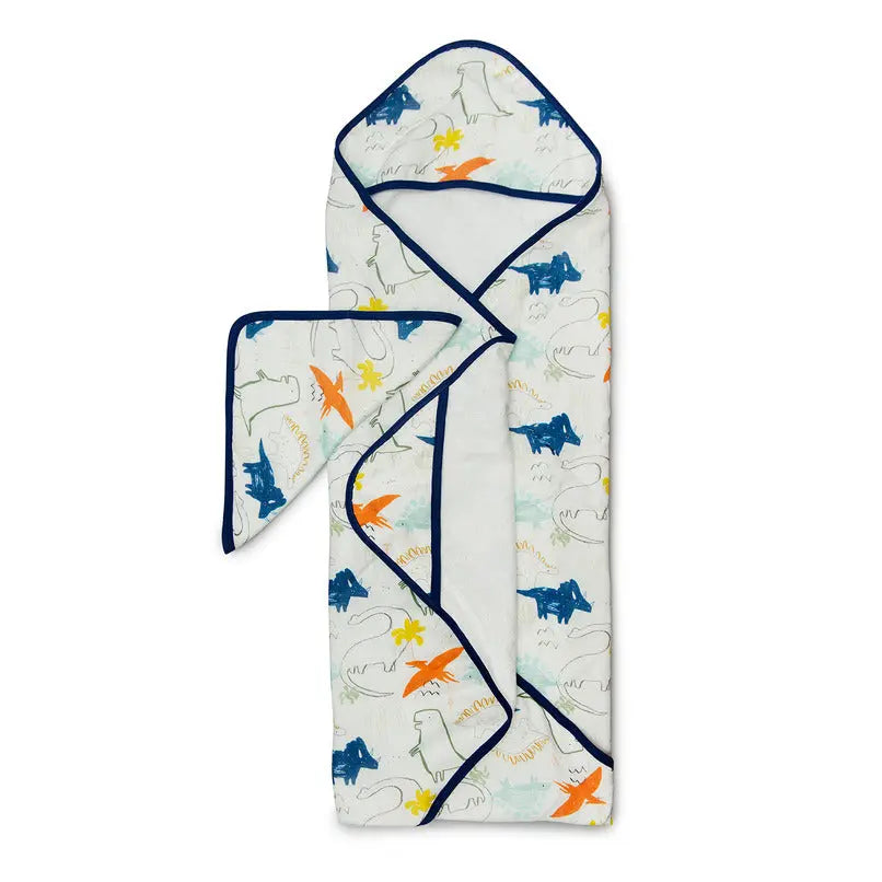 Loulou Lollipop Hooded Towel Set, white with blue/orange dinosaur prints and navy trim, folded to reveal the hood