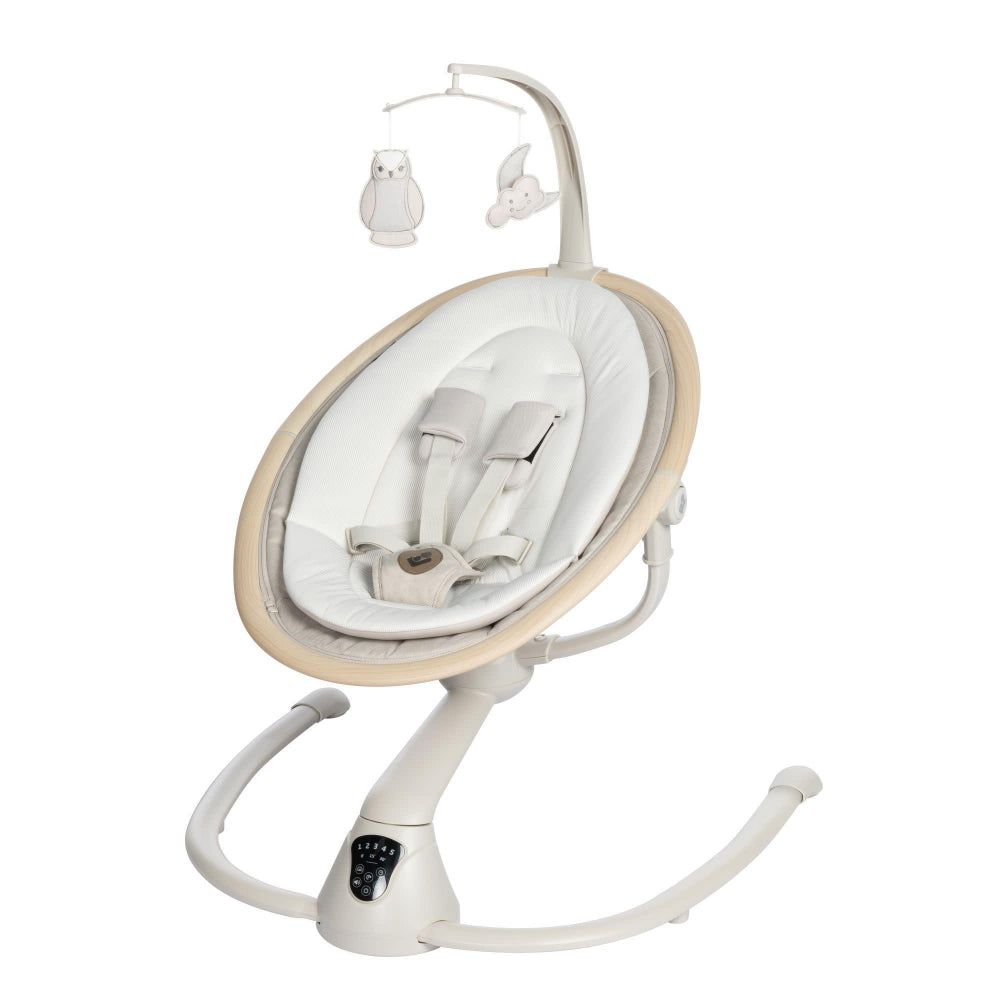 MAXI COSI Cassia Swing in cream with cushioned seat and hanging owl mobile on a curved stand.