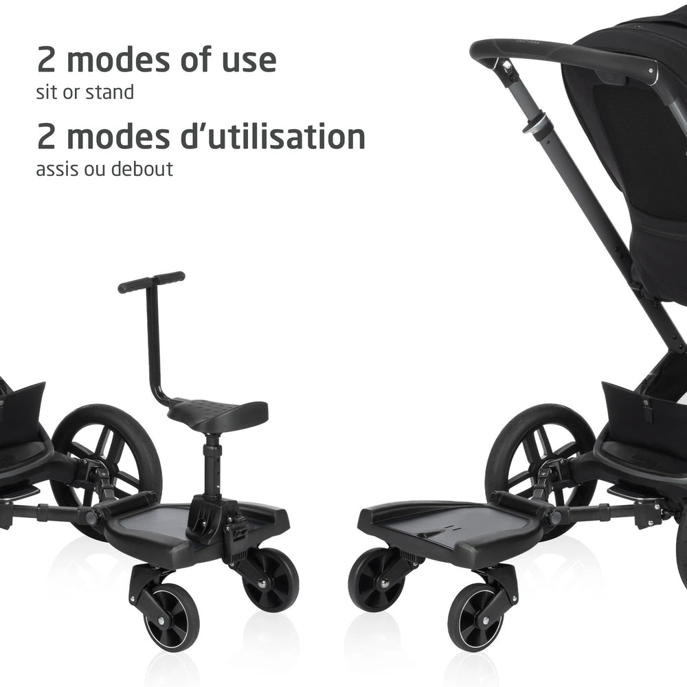 MAXI COSI Hop-on Board for strollers, black, with T-bar handle and front wheels; two units shown
