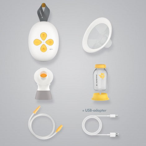 Medela Solo electric breast pump kit with bottle, stand, and USB adapters