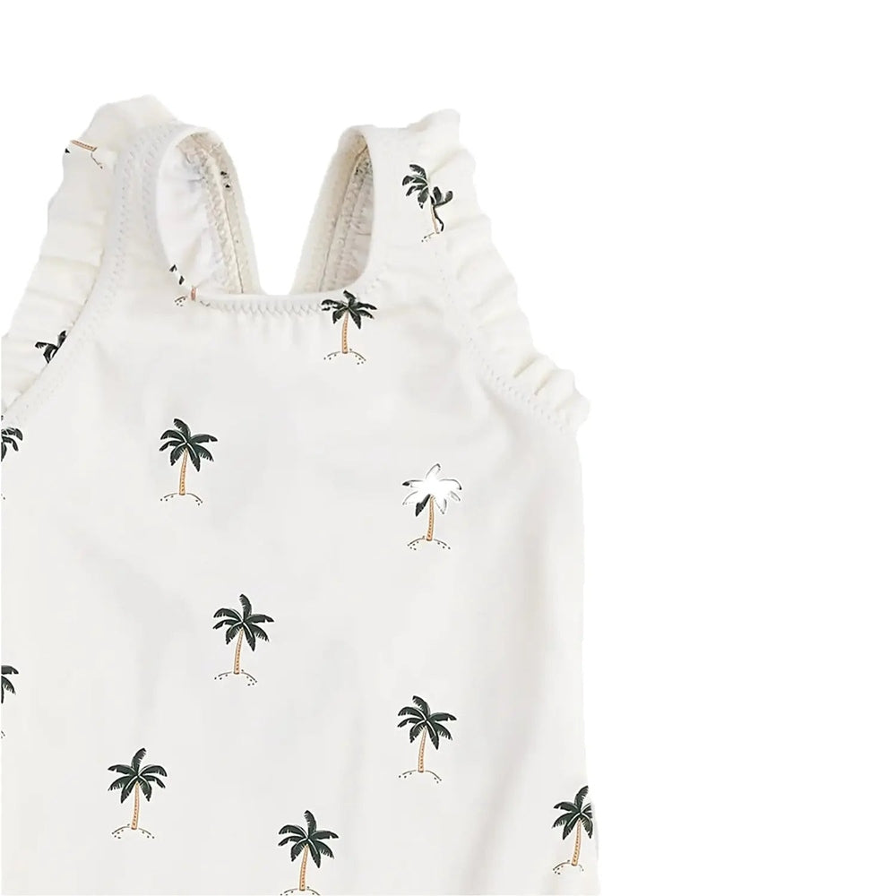 Miles The Label Ruffled Swimsuit Palm Trees, white fabric with frilly straps; palm tree print showcased.