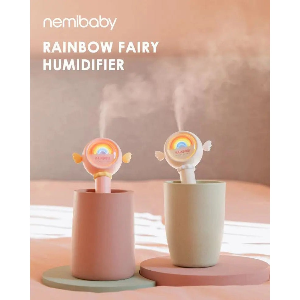 Nemibaby Rainbow Fairy Humidifier pair in pastel pink and mint, releasing soft mist from rainbow-lit heads.