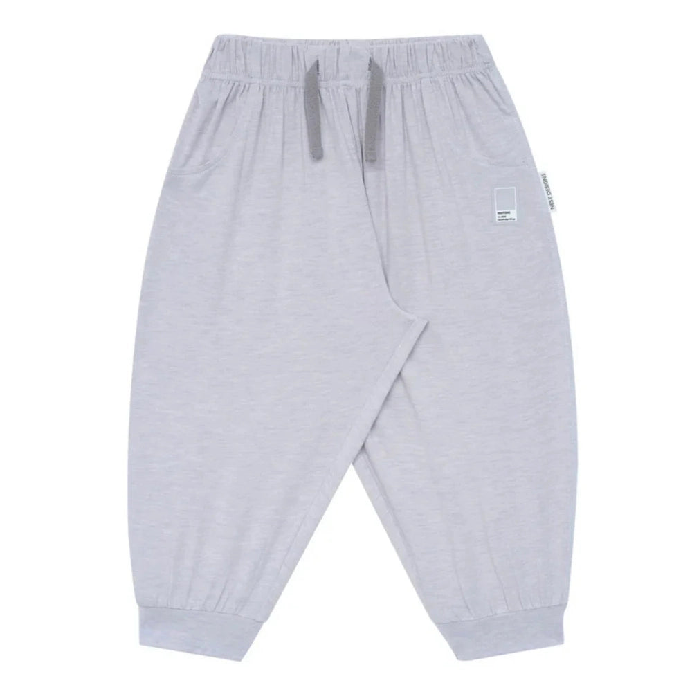 Nest Designs Bamboo Jersey Harem Pants Lavender Blue with drawstring waist and cuffed ankles, laid flat.
