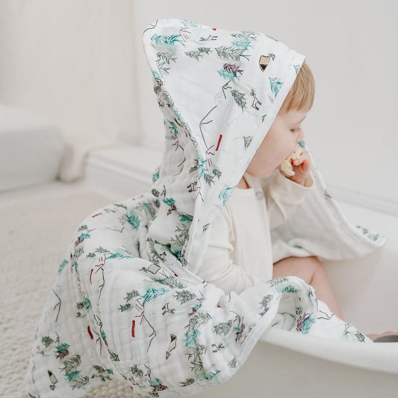 Nest Designs organic cotton hooded baby bath towel, Happy Trails print with teal trees.