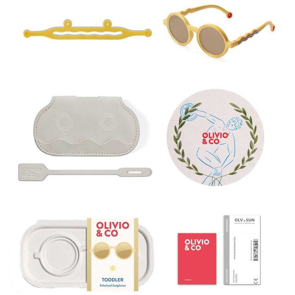 Olivio & Co Round Sunglasses Kids/Junior Classic Olivio Medallion Gold shown with white protective case, cleaning cloth, and cards.