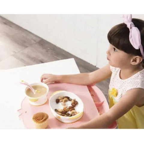Piyo Piyo Foodie Silicone Placemat Yellow keeps bowls steady as a toddler dines at mealtime.