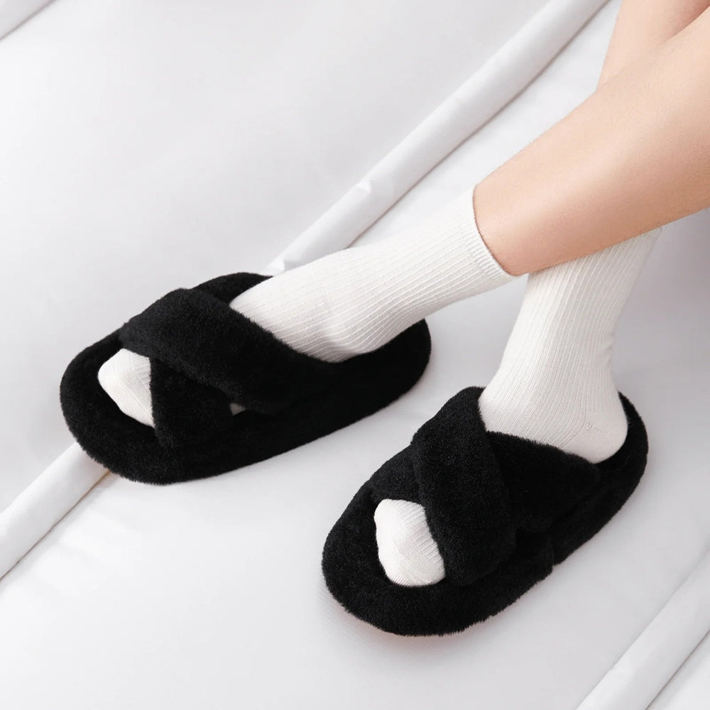 POSEE Cross Strap Plush Fashion Slippers Black worn by feet in white socks, fluffy and cozy.