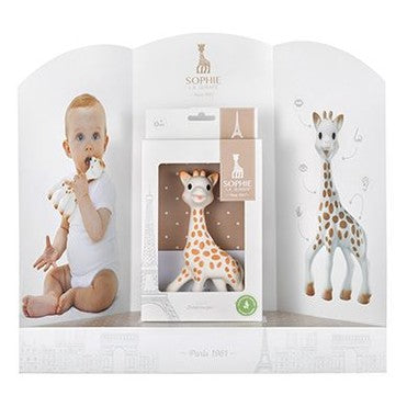 Qhouse Kids Sophie La Girafe Presentation Display featuring a Sophie toy in white packaging, with a baby beside.