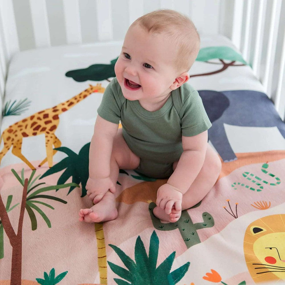 Rookie Humans cotton sateen crib sheet in the Savanna with safari animals and palm trees