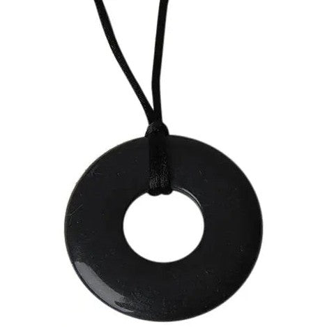 Teethease Original Pendant black circular donut pendant on a black cord necklace, hanging from the loop.