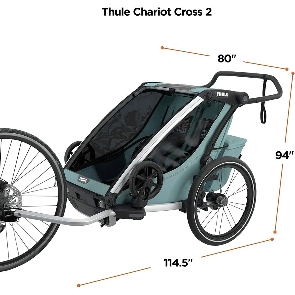 Thule Chariot Cross Multisport Bike Trailer Alaska Blue pulled behind a bike, showing large wheels and teal canopy.