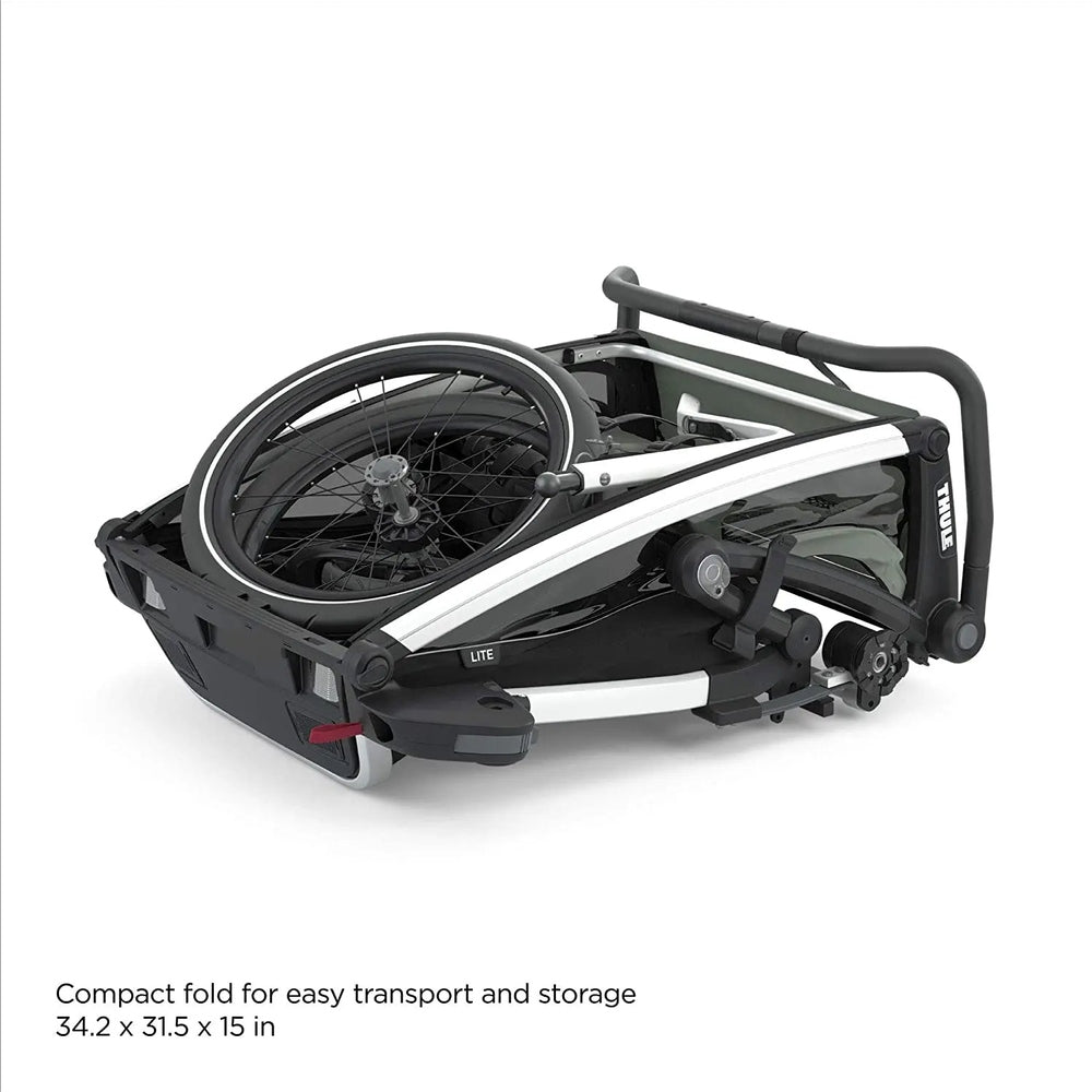 Thule Chariot Lite Multisport Bike Trailer Agave Green, folded with wheel mounted for compact transport.