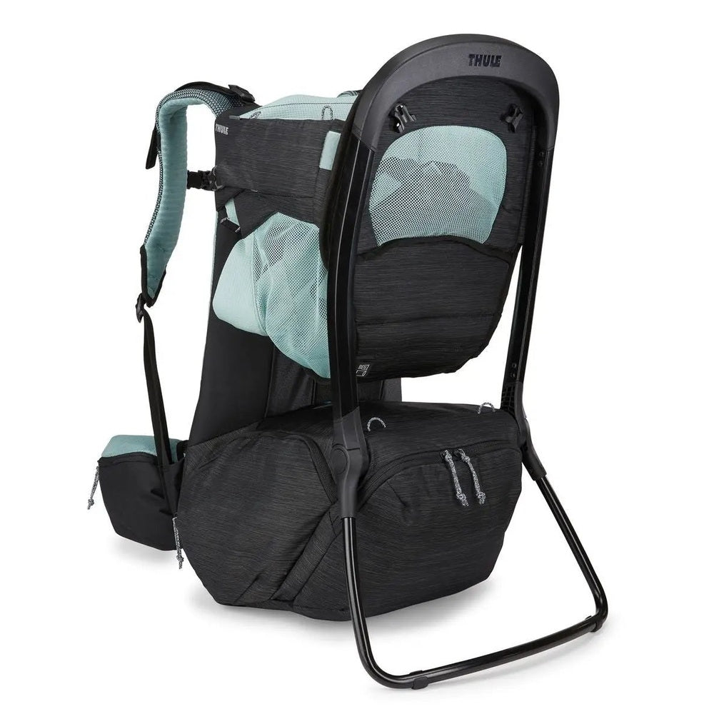 Thule Sapling Child Carrier in black with teal mesh panels on a sturdy frame and padded straps.