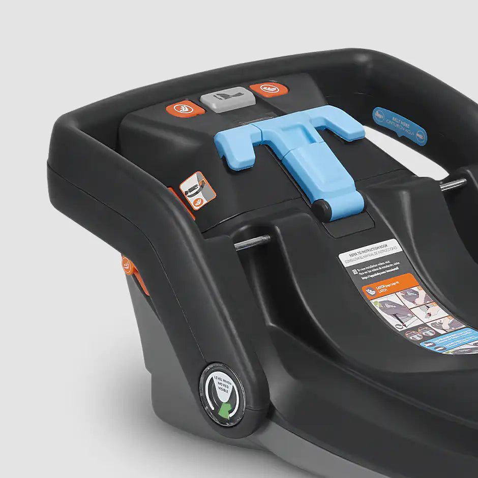 Uppababy Mesa infant car seat base with blue LATCH connectors and blue adjustment handle plus orange control buttons.