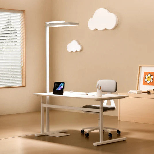 Yeelight Natural Light Floor Lamp, white finish, in a modern home office beside a white desk and chair.