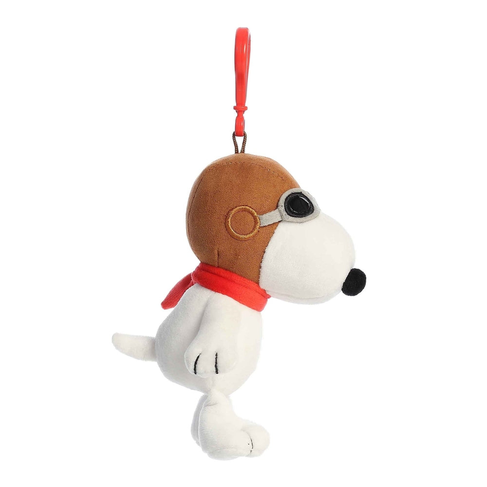 Aurora Peanuts Flying Ace Clip-On 5-inch plush Snoopy wearing goggles and red scarf, with red clip.