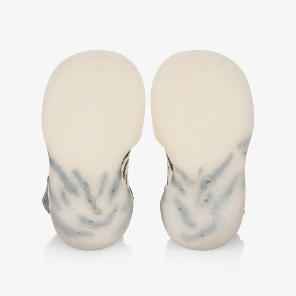 Mayoral newborn baby slipper socks in cream knit, bottom view showing grip dots on soft soles.