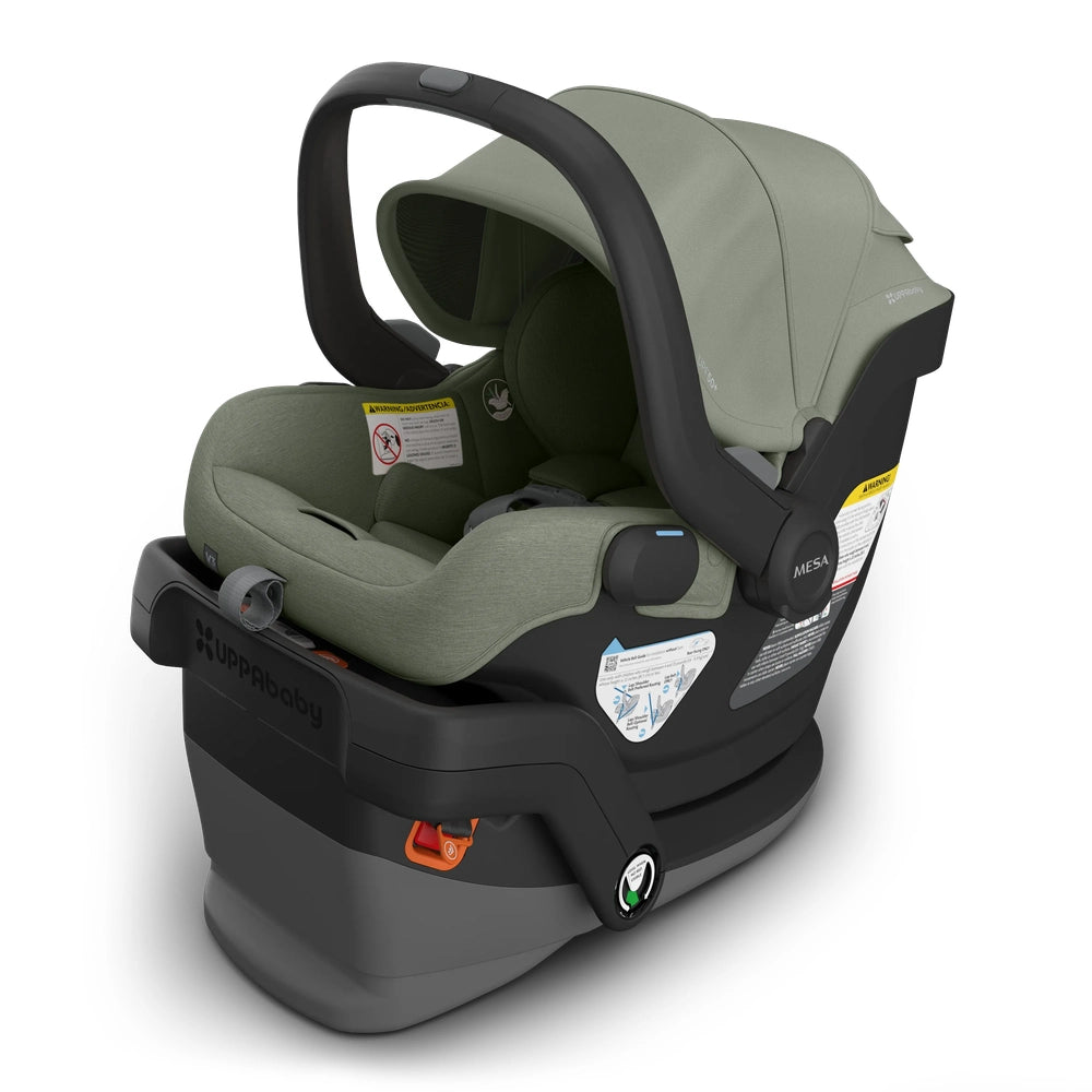 UPPABABY Mesa V3 Infant Car Seat in olive green with raised carrying handle and sturdy base.