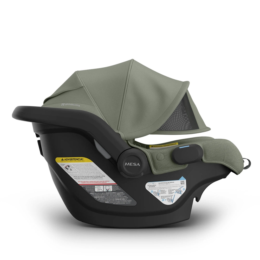 UPPAbaby Mesa V3 Infant Car Seat in olive green, securely mounted on base with extended canopy.