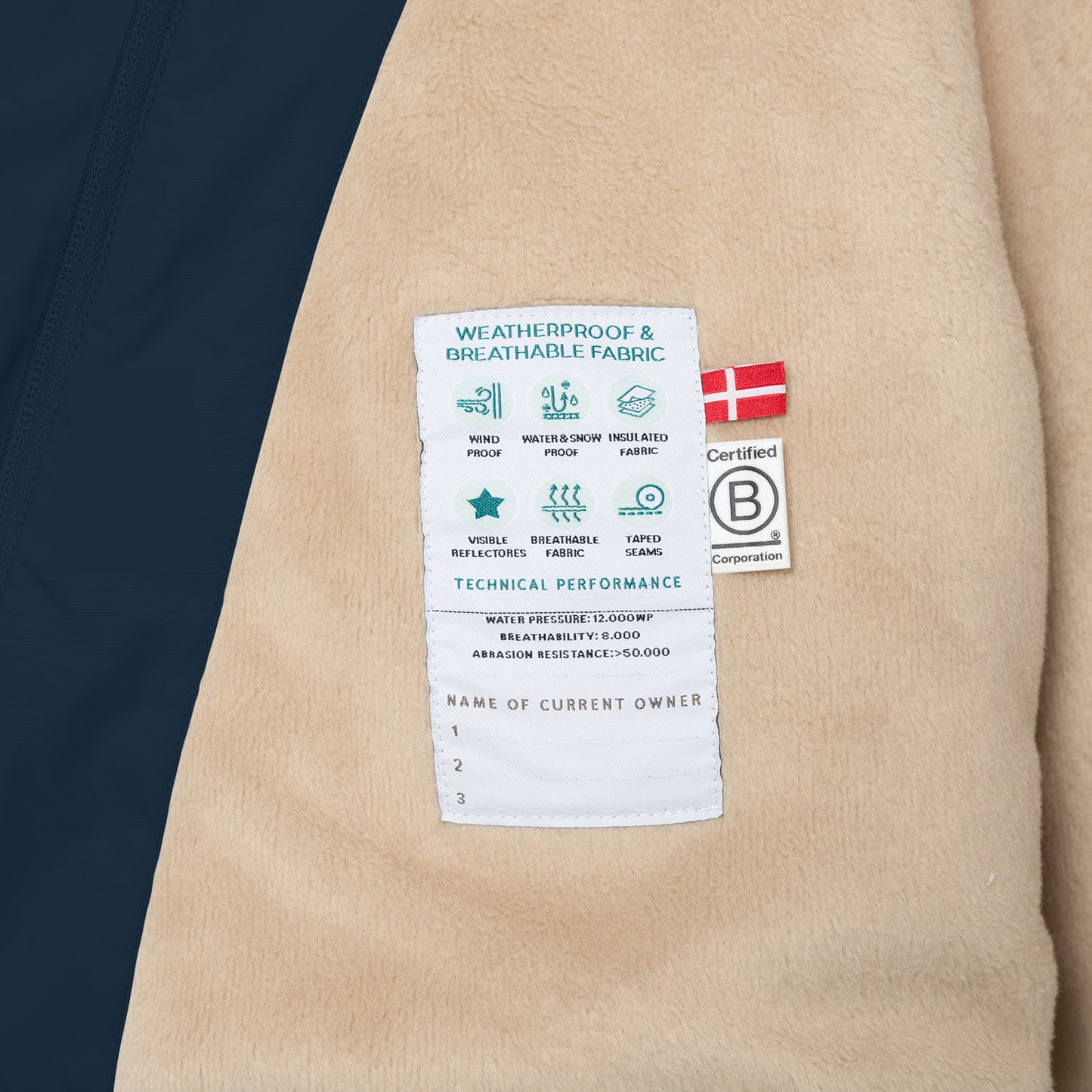 MINI A TURE Matwang fleece-lined winter jacket beige with Danish flag patch and B Corporation badge.