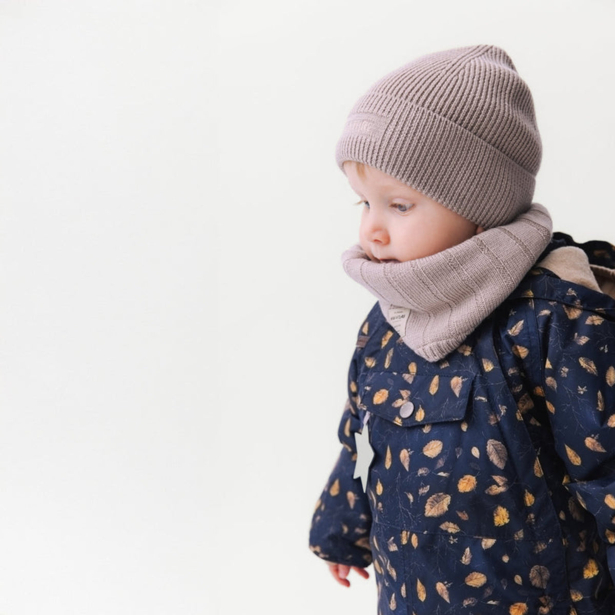 Mini A Ture Matwang fleece-lined winter jacket in navy with falling leaves print for toddlers