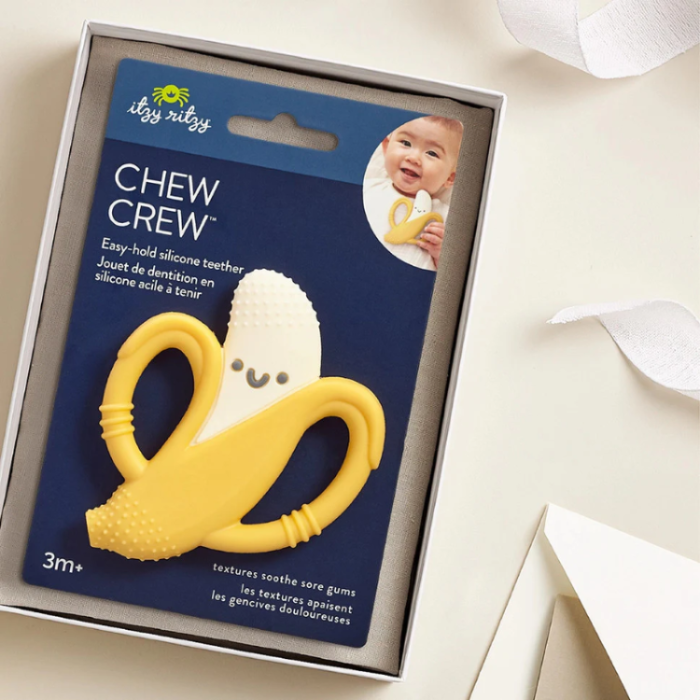 Itzy Ritzy Chew Crew teether, yellow banana silicone with white textured center