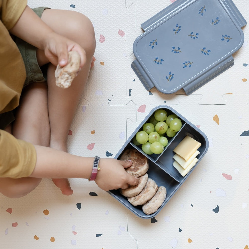 3 Sprouts recycled plastic bento box in blue, open to reveal grape compartment and cheese slices