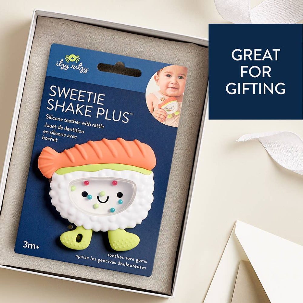 Itzy Ritzy Sweetie Shake Plus teether rattle; orange hair, lime green feet