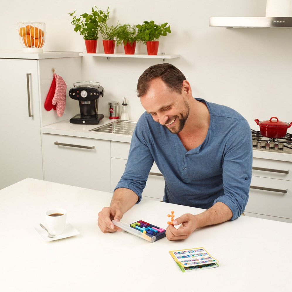 Smart Games IQ Fit puzzle with colorful pegs