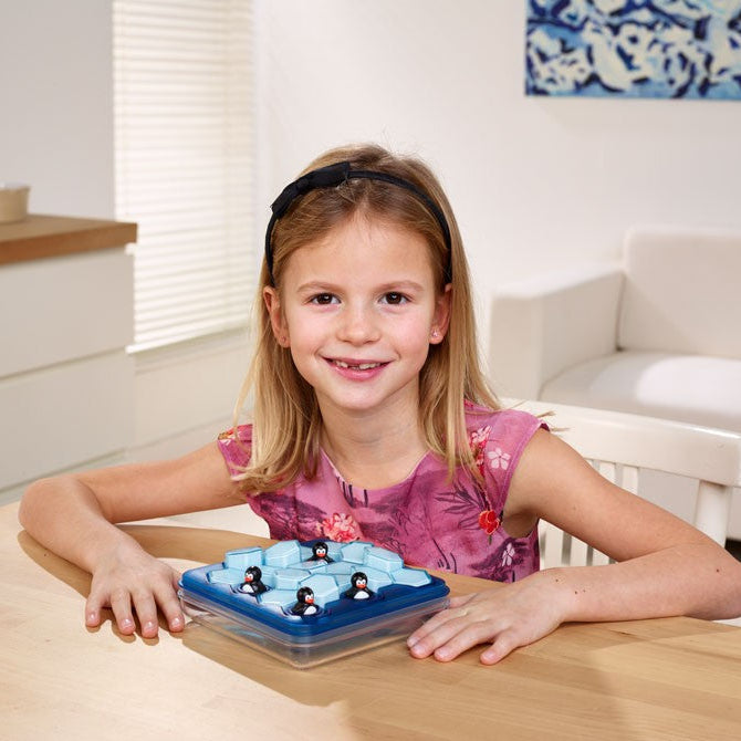 Penguins Pool Party game in blue tray with penguin pieces