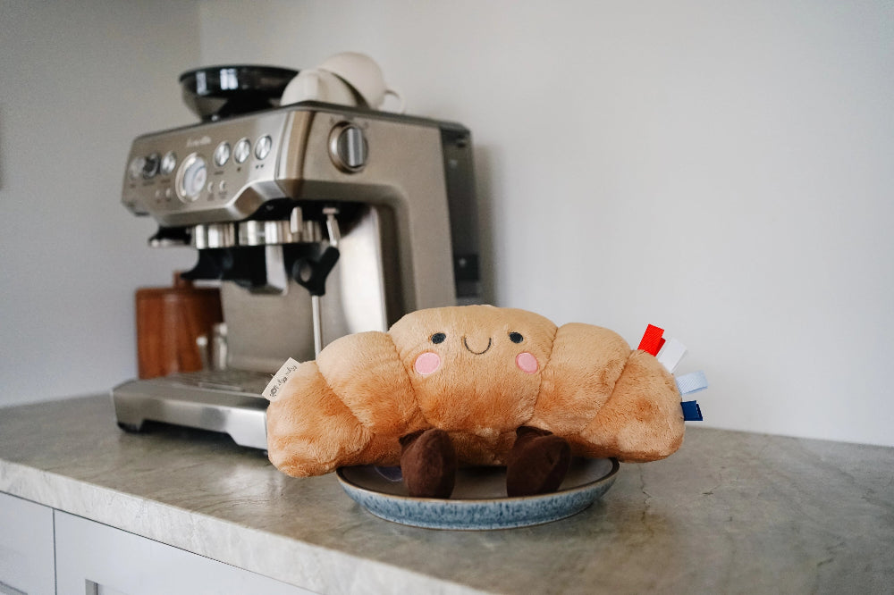 Itzy Ritzy Sweetie Snuggles plush orange with pink cheeks and brown feet